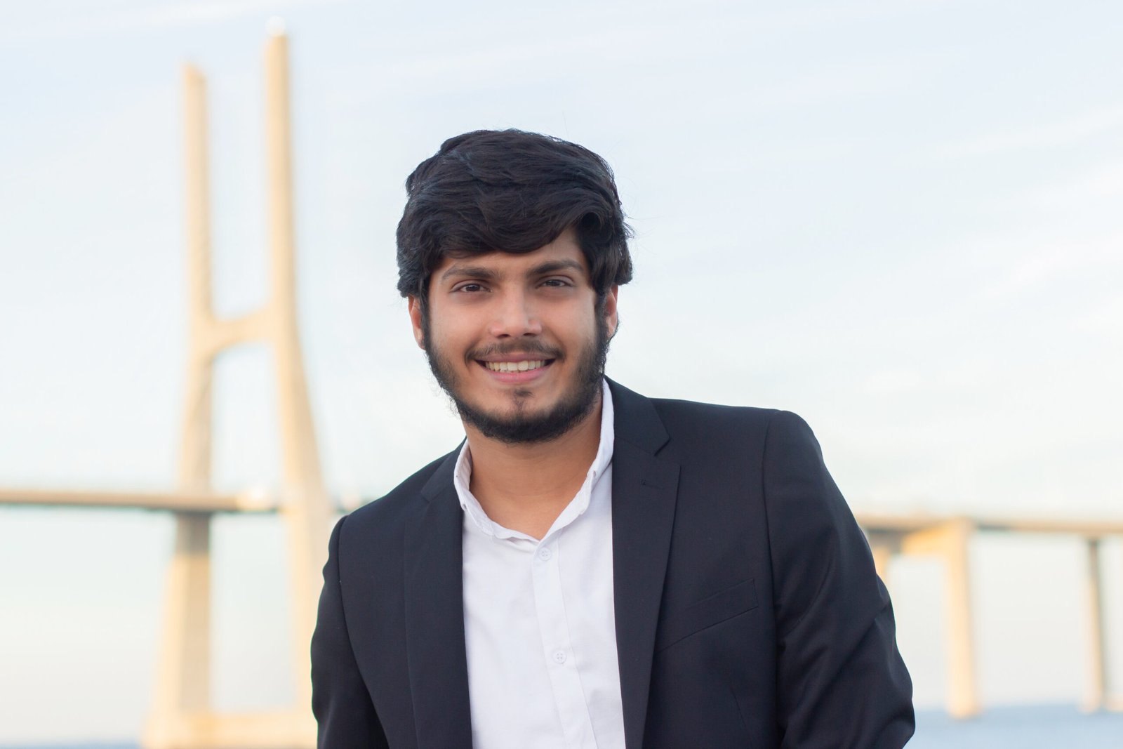 portrait of good looking smiling arabic man in suit