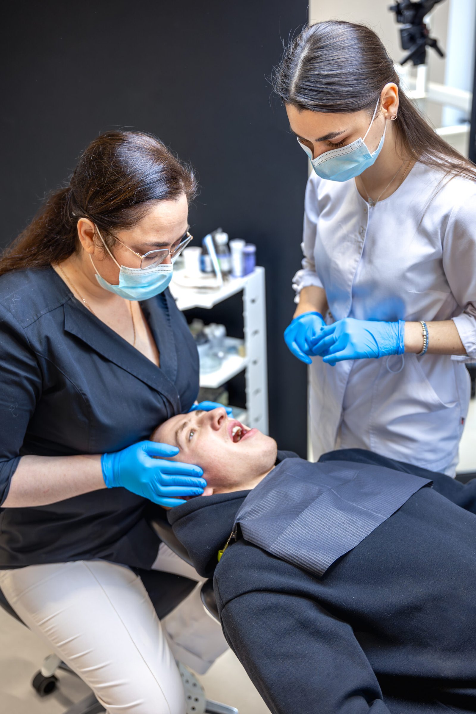 team of female dentists treating patient's teeth. visit to the dentist. dentistry.